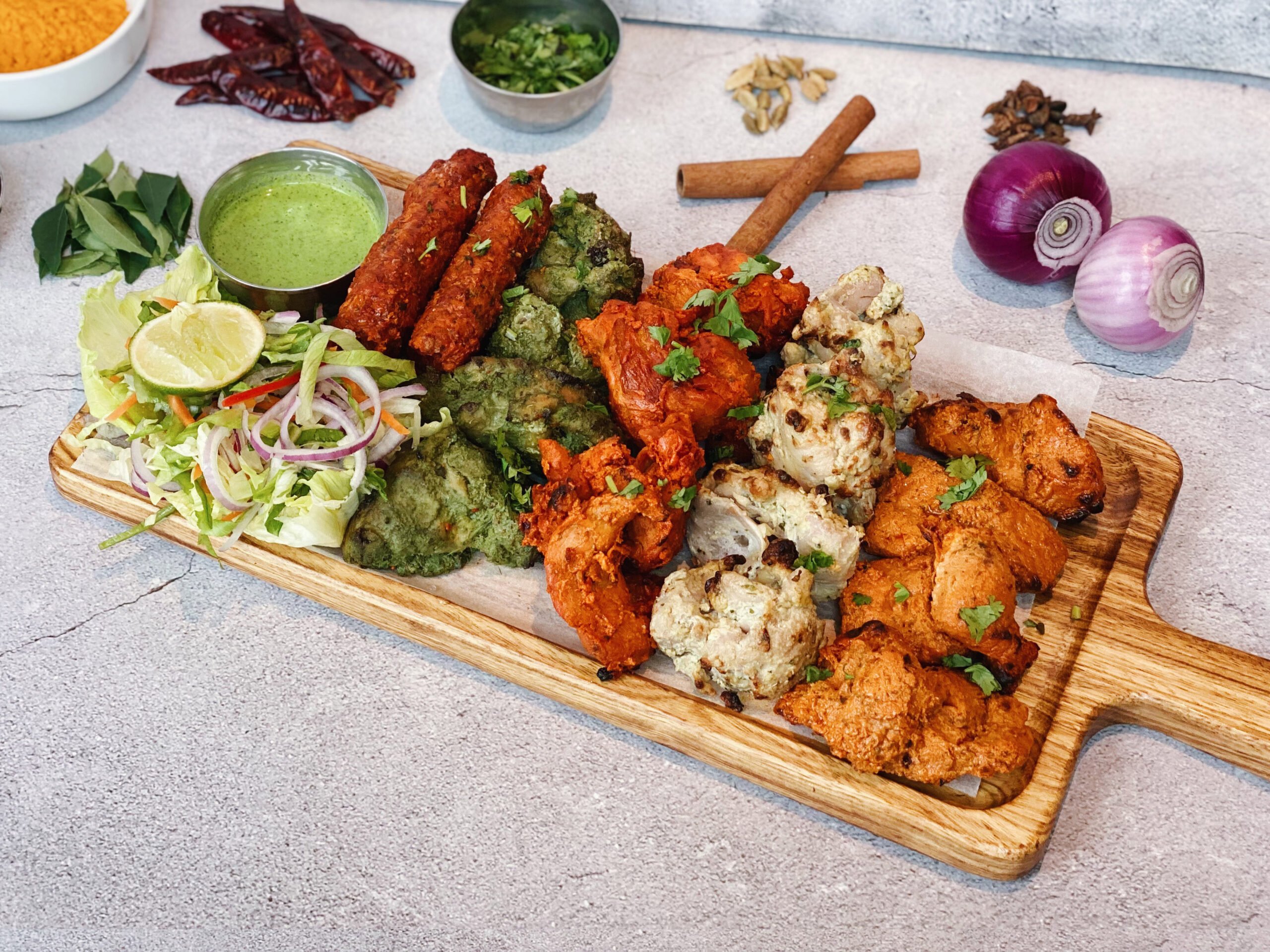 Butter chicken curry with basmati rice and vegetables